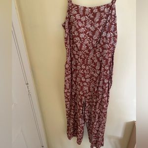 A spaghetti strap jumpsuit w a leaf print